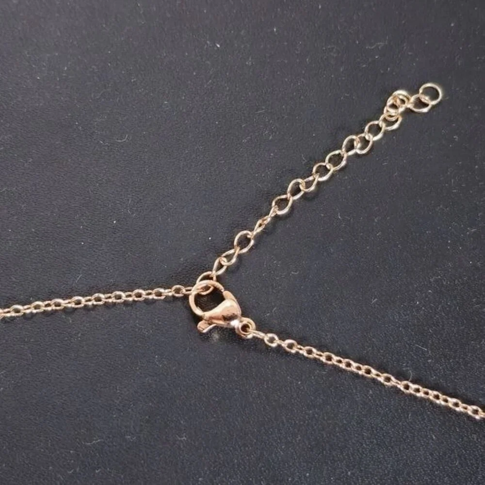 Interlocking Mobius Engraved Necklace‎ in Rose Gold (NWOT)
